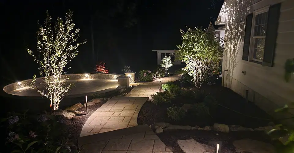 house exterior at night featuring outdoor lighting