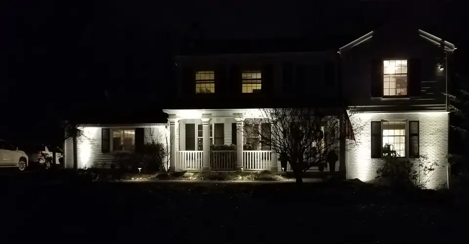 house exterior at night featuring outdoor lighting