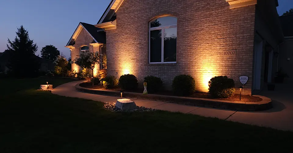 house exterior at night featuring outdoor lighting